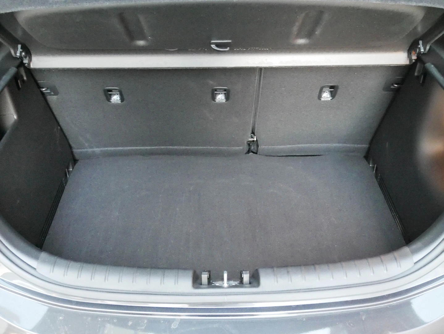 The boot of the Kia Rio hides a space saver spare tire