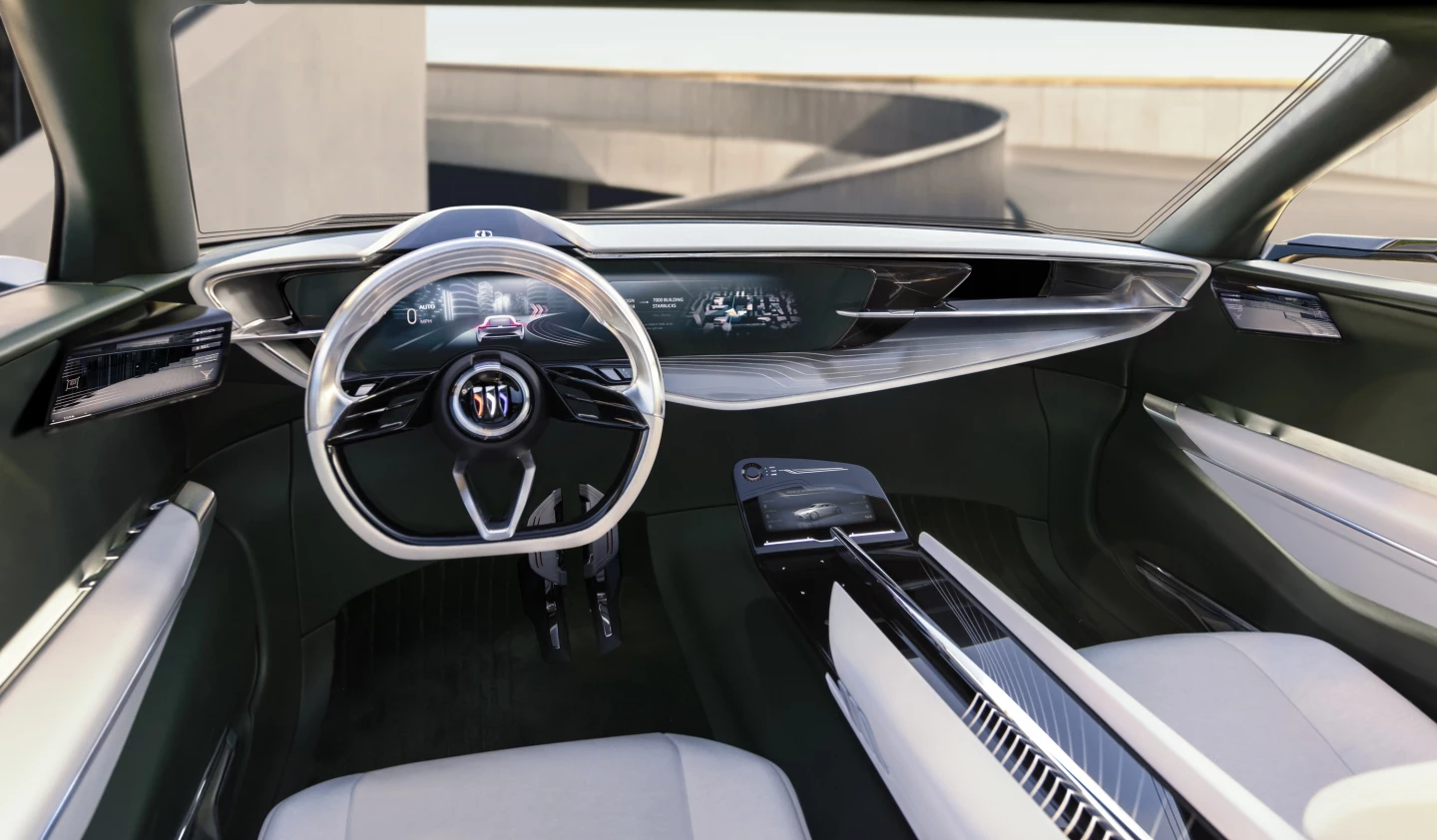 The Wildcat EV interior features a large digital instrument display, secondary center screen, full-length console and flat-bottom steering wheel