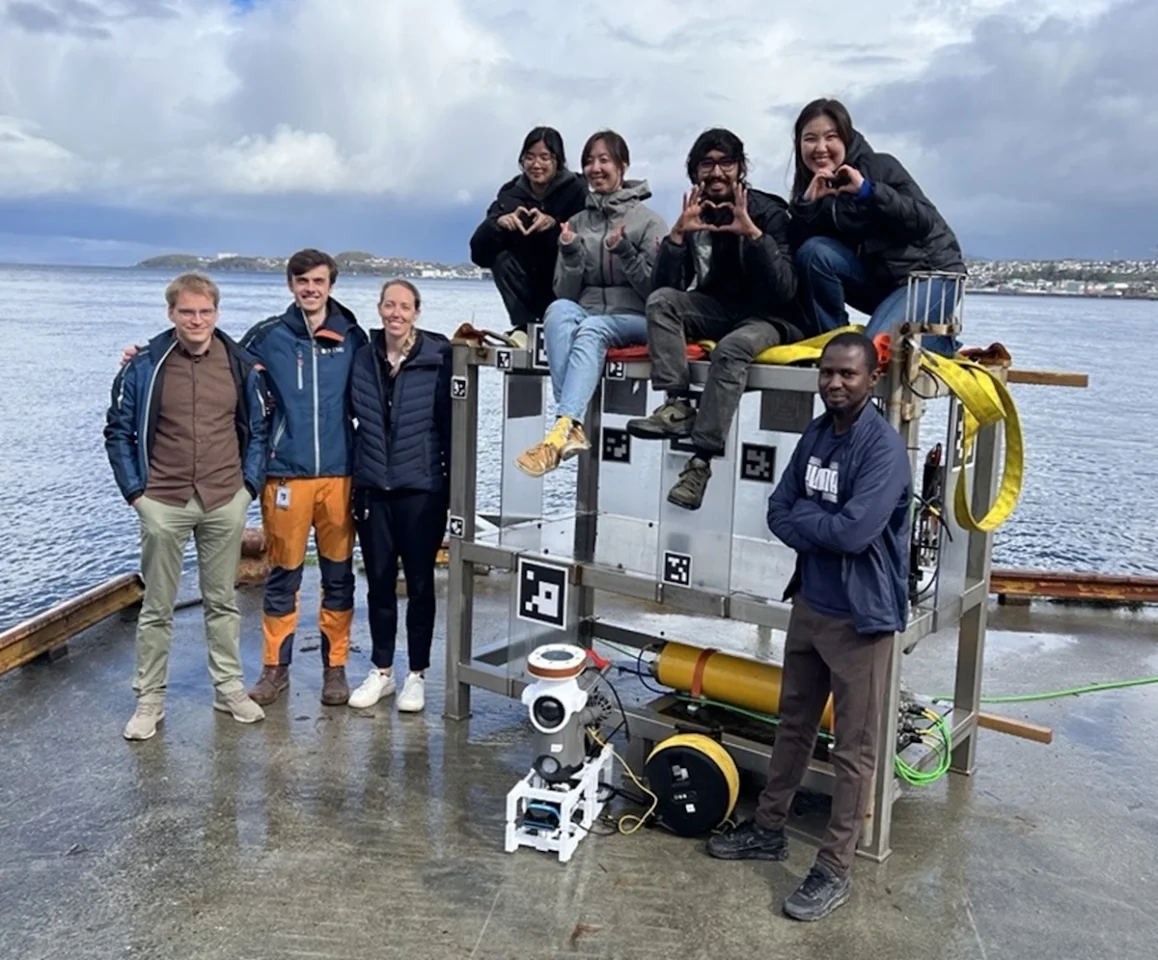 The autonomy project team with the Blueye X3 underwater robot and docking station