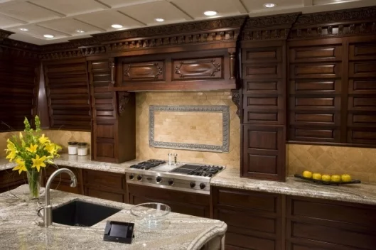 Cupboards can slide vertically in unison by setting 'scenes' on the touch panel remote control (pictured on bench top)