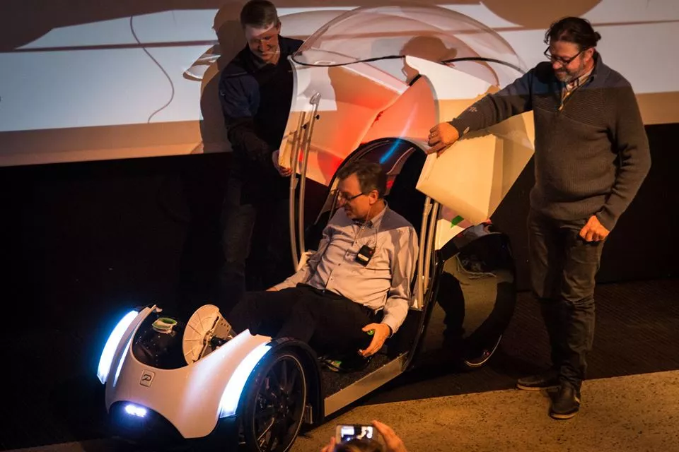 Opening the hinged canopy of the Podbike T0