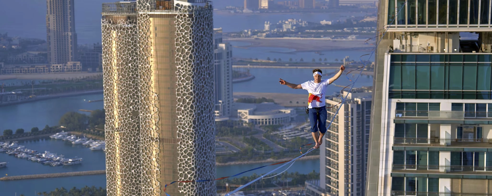 Jaan Roose slacklines the Crescent Towers in Qatar