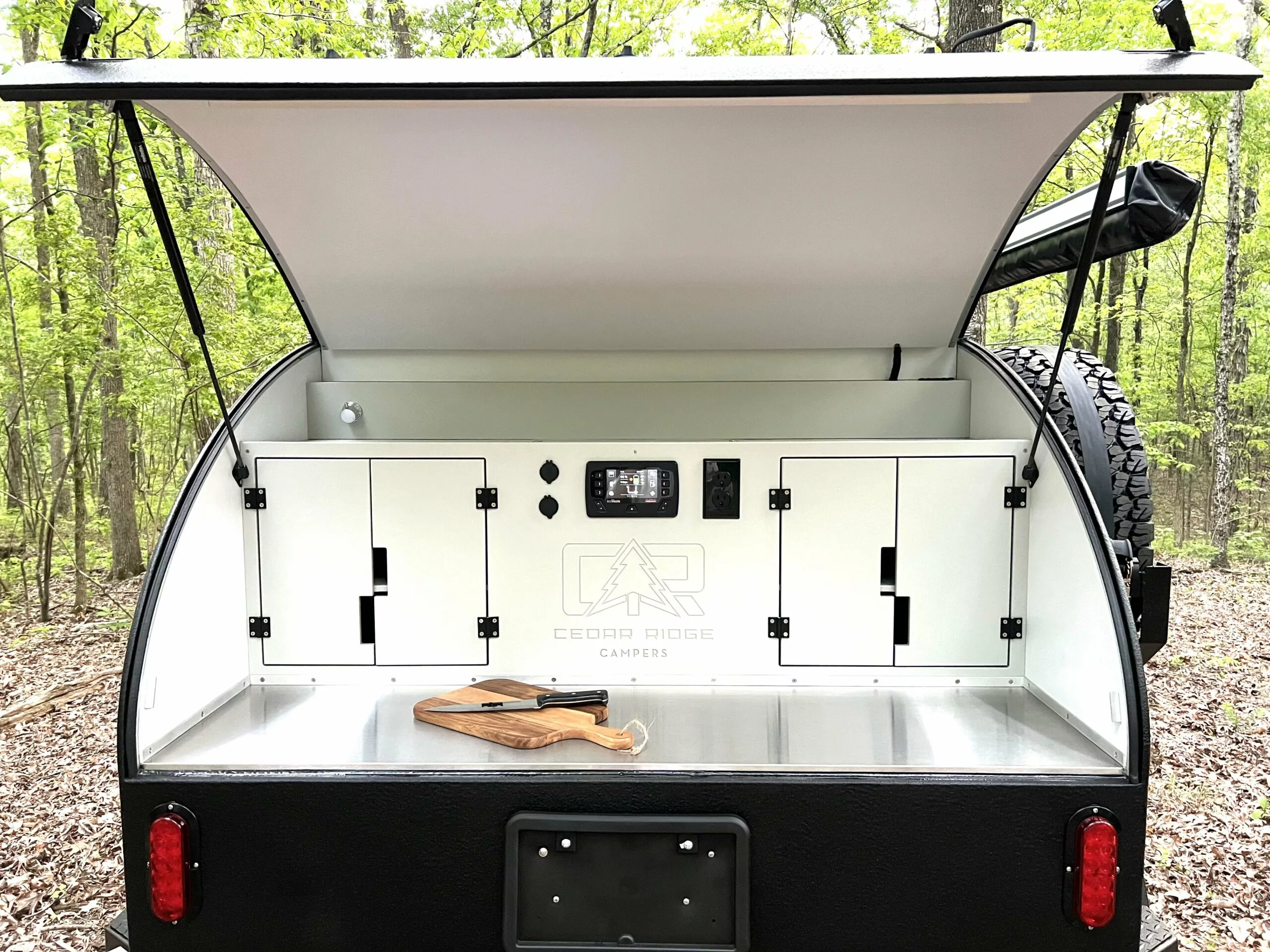 HDPE cabinetry and a full-width stainless steel counter offer serious work and organizational space