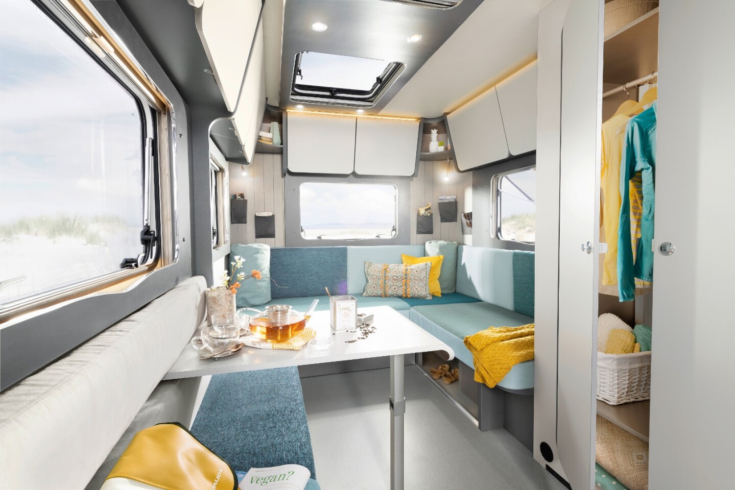 A look at the central dining nook and rear sofa on the standard Dethleffs Coco floor plan