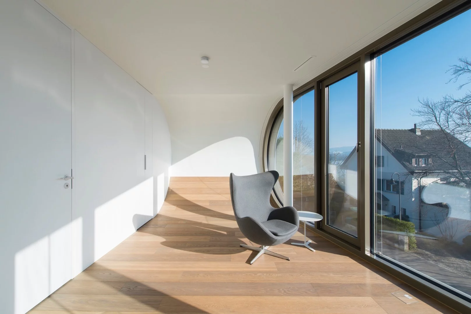 The upper levels include a pair of bedrooms and bathrooms