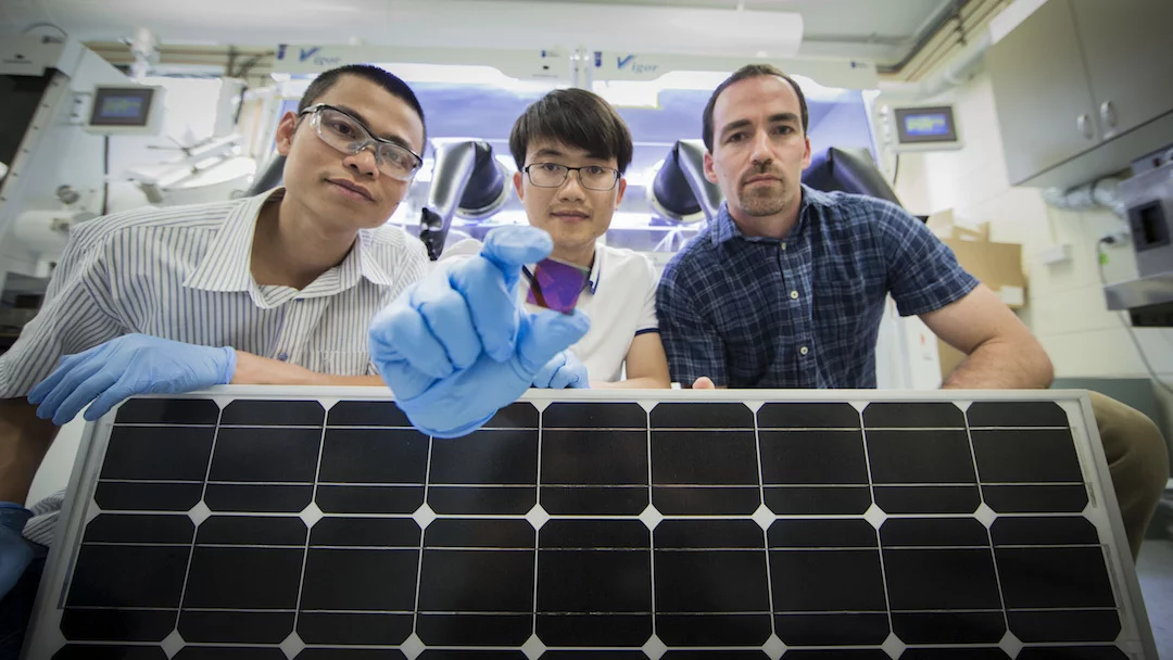 The ANU researchers, from left, The Duong, Jun Peng and Tom White, with a perovskite solar cell