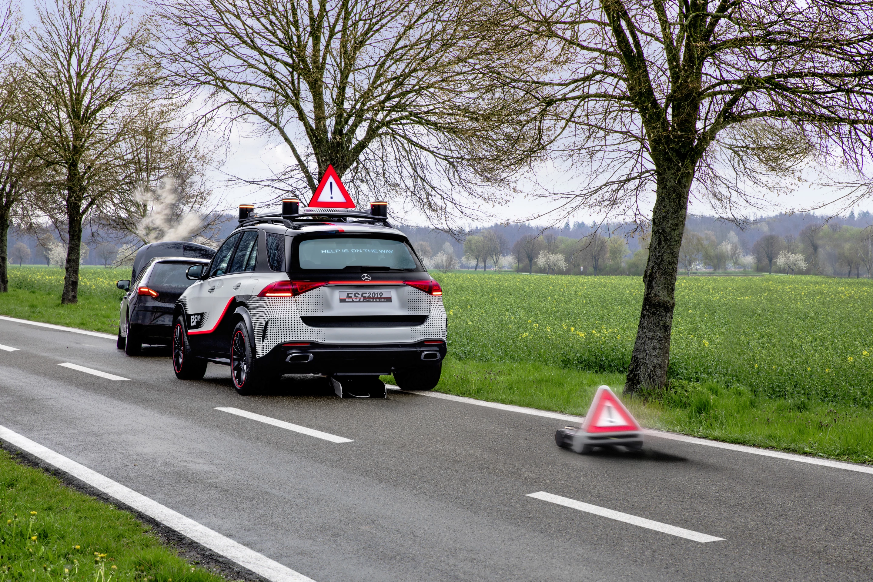 A robotic emergency road sign pops out of the car and rolls its way up the highway so other traffic can be made aware of an incident without the driver needing to get out of the car