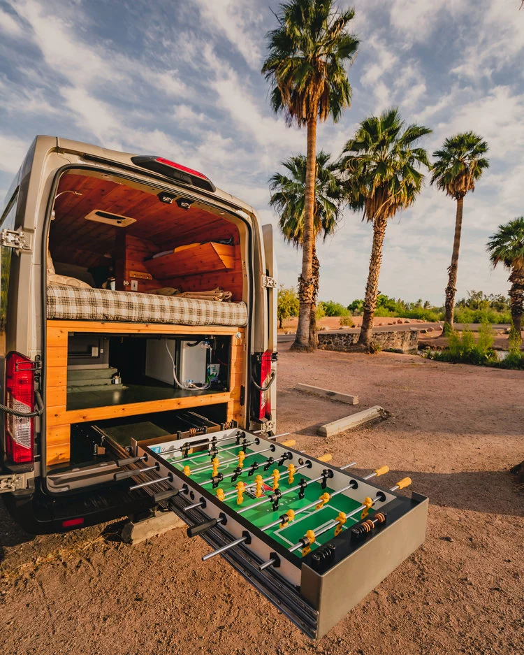 Quirky camper van additions are always fun to see, and this is the first slide-out foosball table we've stumbled upon