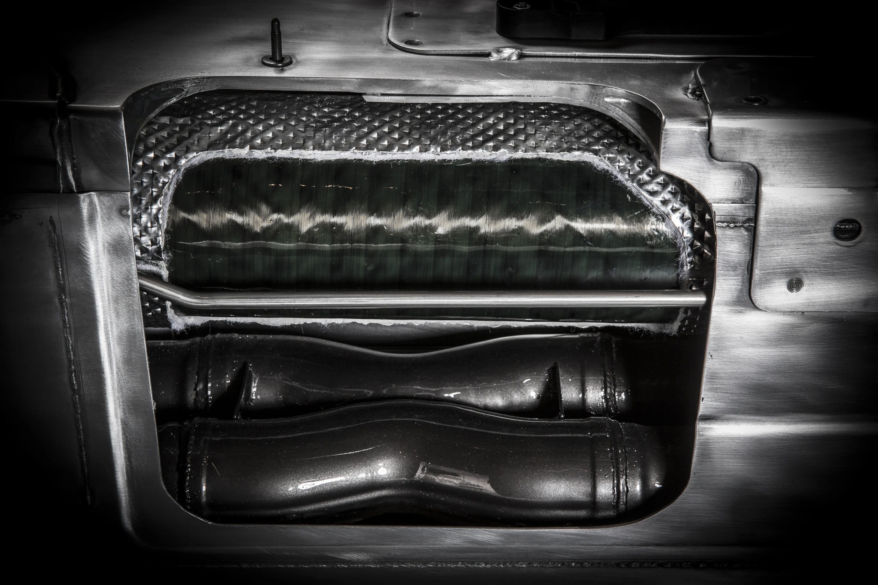 An Aussie sourced carbon fiber 6.5-ft long torque tube handles twisting forces between engine and differential