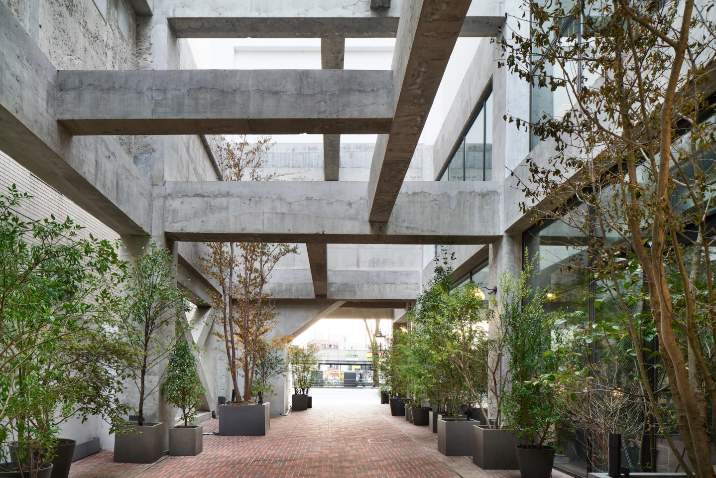 The Heritage Tower involved renovating a 1970s-era hotel building by removing much of its interior and turning its lower floors into a light and plant-filled lounge