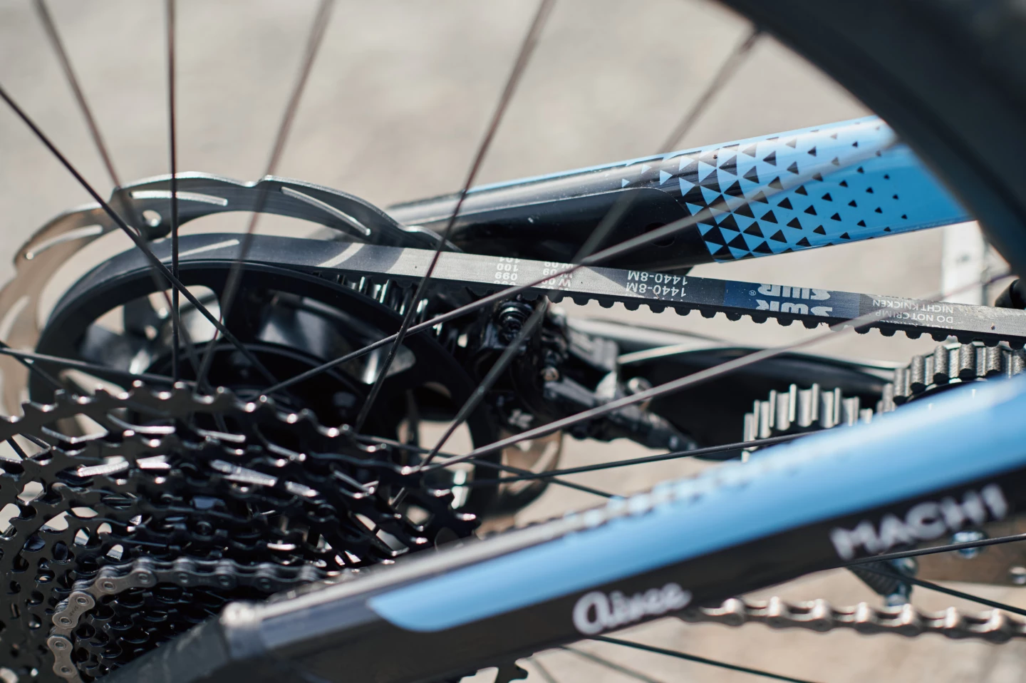 The dual transmission system uses a belt drive for the motor and a chain for the 12-speed mechanical gears