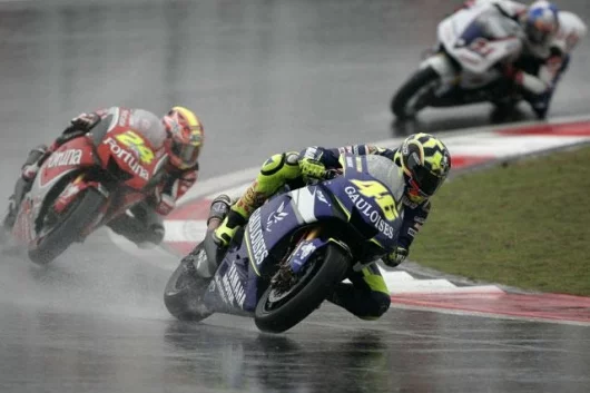 Valentino Rossi leads Toni Elias and John Hopkins in the early stages of the race - Elias had a ride-through penalty to ruin his chances of a good result
