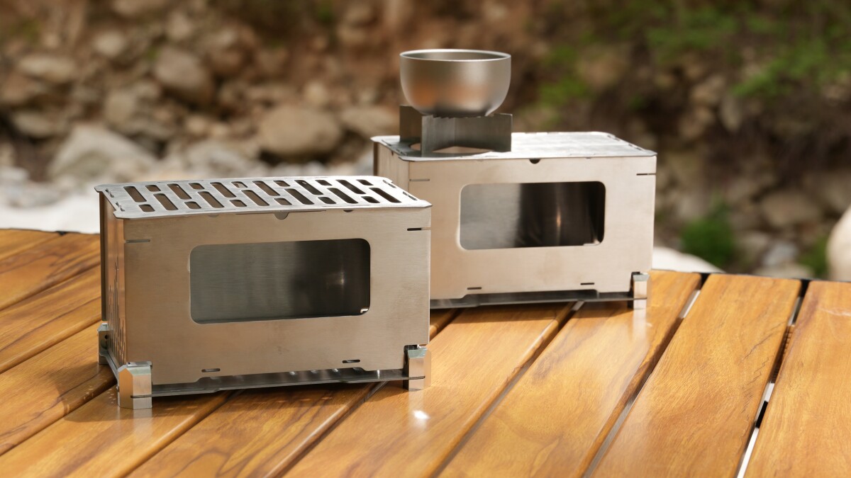 Modular flatpack camp stove pops up for four types of cooking