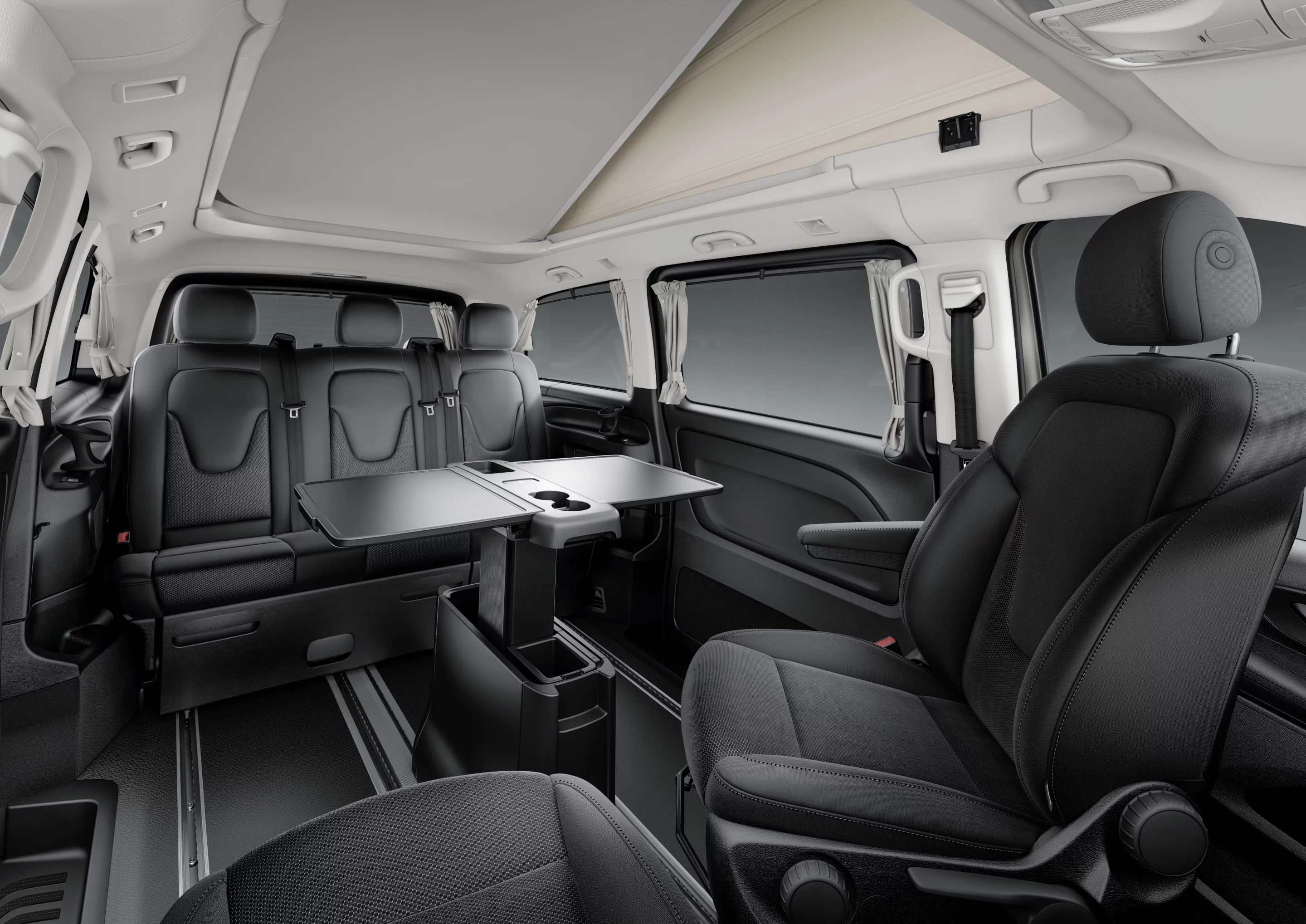 A three-seat rear bench/bed, swivel front seats and retractable table create a dining lounge
