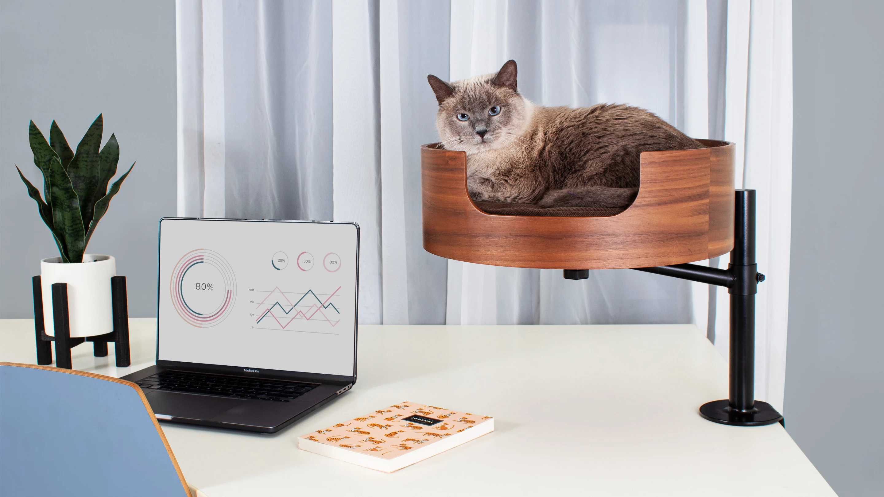 The elevated bed means less keyboard catwalks, but is still close enough for your baby to judge you