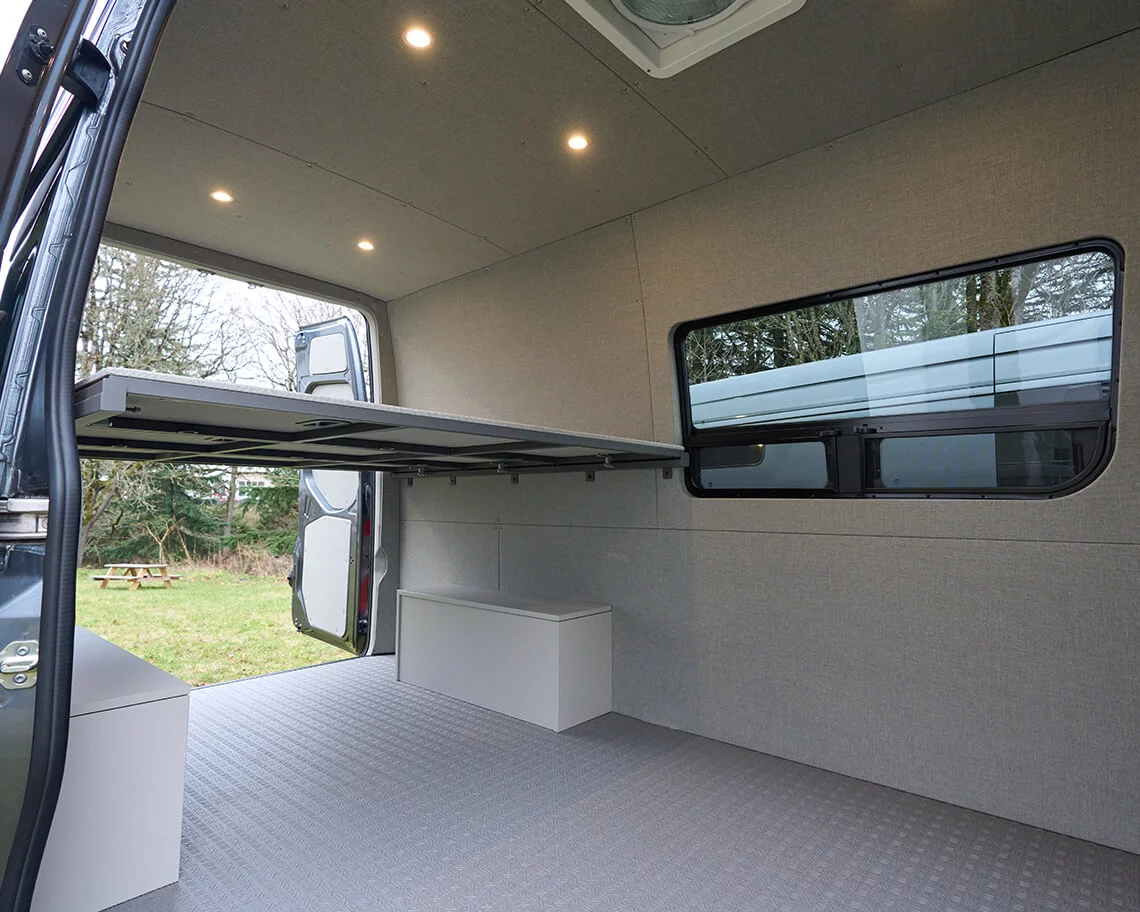 With its standard three-panel bed, the Baseline is a functional light camper for two people even before buyers fill it out with a greater floor plan
