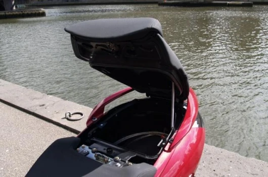 Push the key in and turn right to open the large underseat storage area