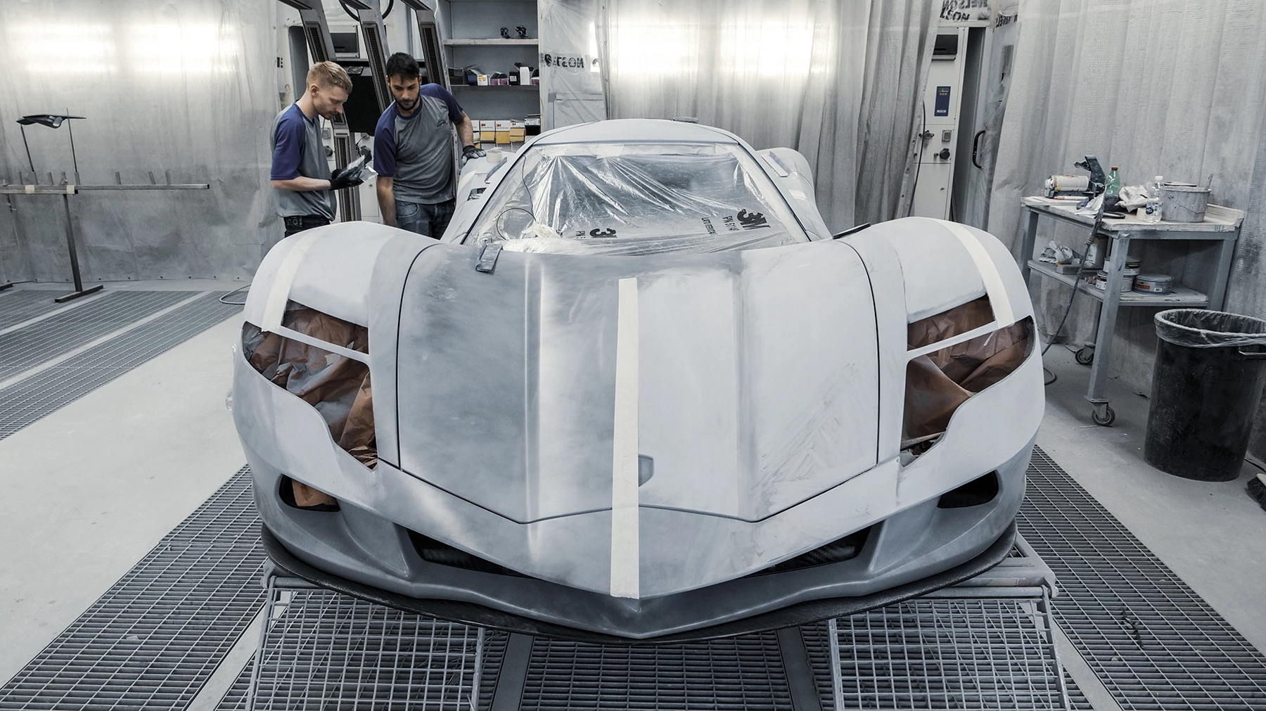 Aston's carbon fiber bodywork is draped over a carbon monocoque