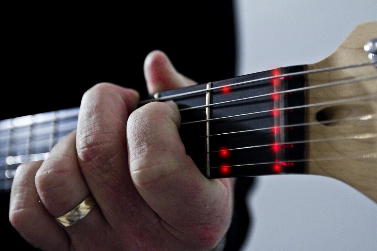 The Fretlight learning system uses LED lighting to show students finger placement on a guitar neck, with lights triggered in response to video-based lessons and/or software on a computer