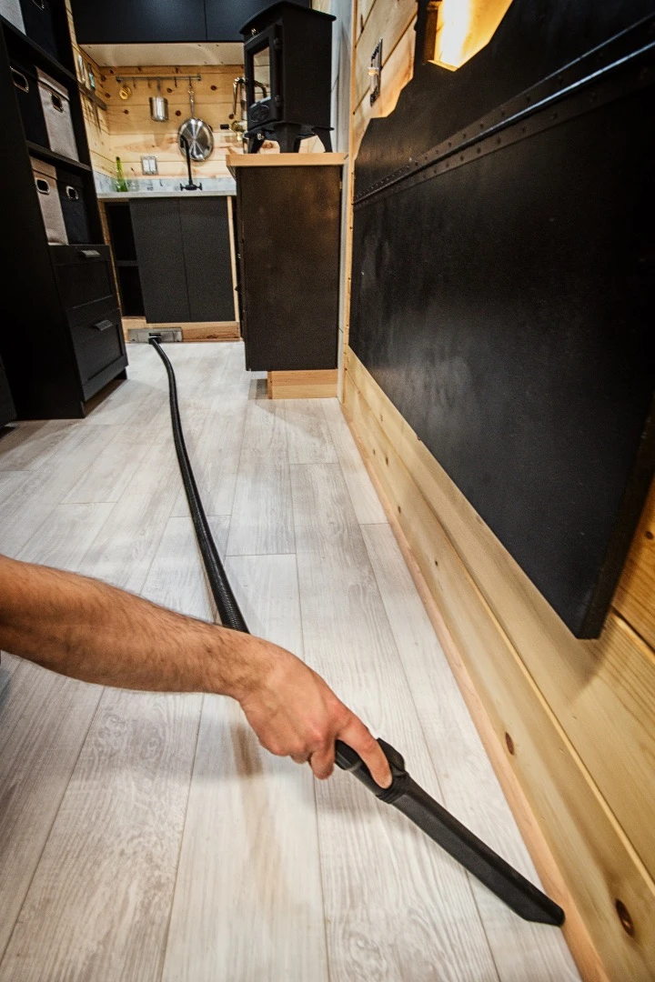 The Acorn features a built-in vacuum cleaner