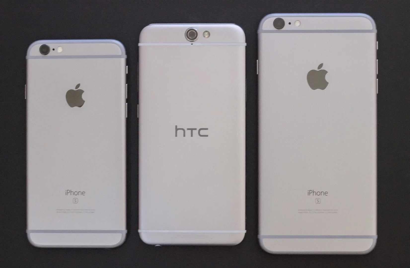 HTC One A9 (center), flanked by the iPhone 6s and iPhone 6s Plus