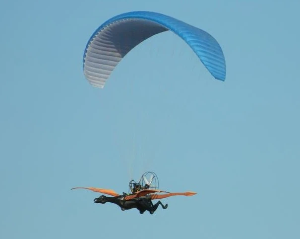 According to the patent filing, it's actually an ultralight aircraft using an inflatable parawing combined with a rear-mounted fan, which a single pilot uses to steer and keep the vehicle airborne