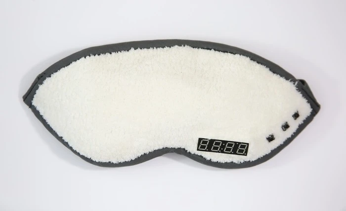 The Napwell mask as seen from the outside, with a digital timer acting as an alarm clock