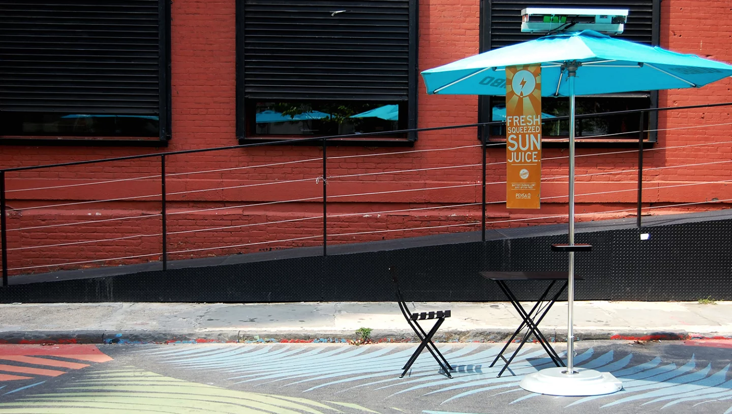 The Pensa cafe umbrella prototype waiting to charge up mobile devices via PV panels on top