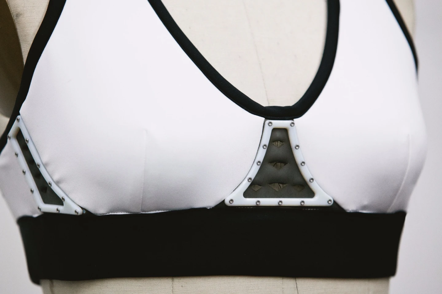 Vents in the Chromat Aeros Sports Bra open to provide a cooling air flow when changes in the wearer's perspiration, breathing and body temperature are detected