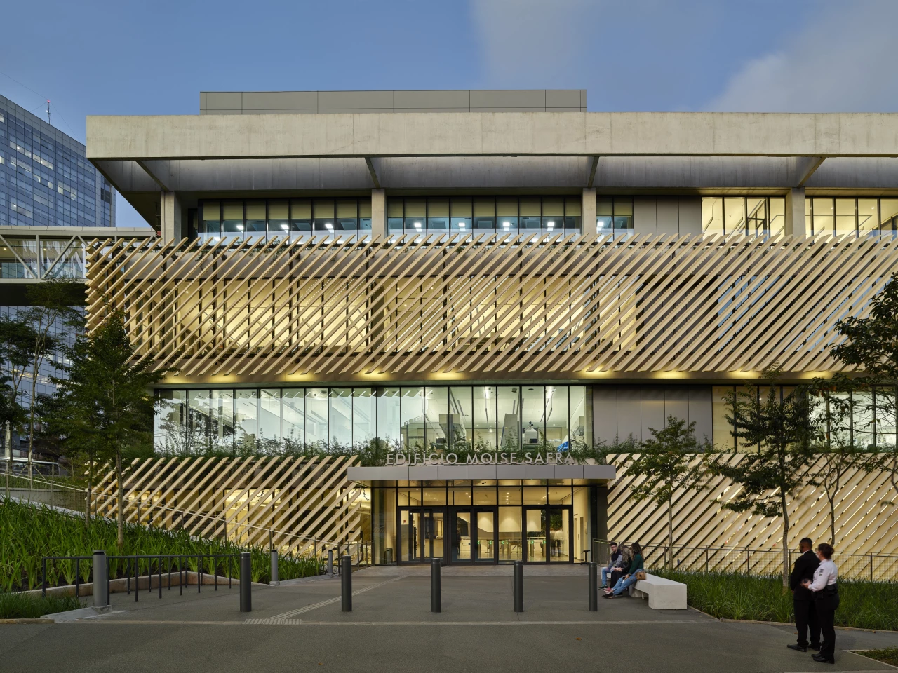 The Albert Einstein Education and Research Center's glazed facade is shaded from the sun using louvers, overhangs, and a latticed screen