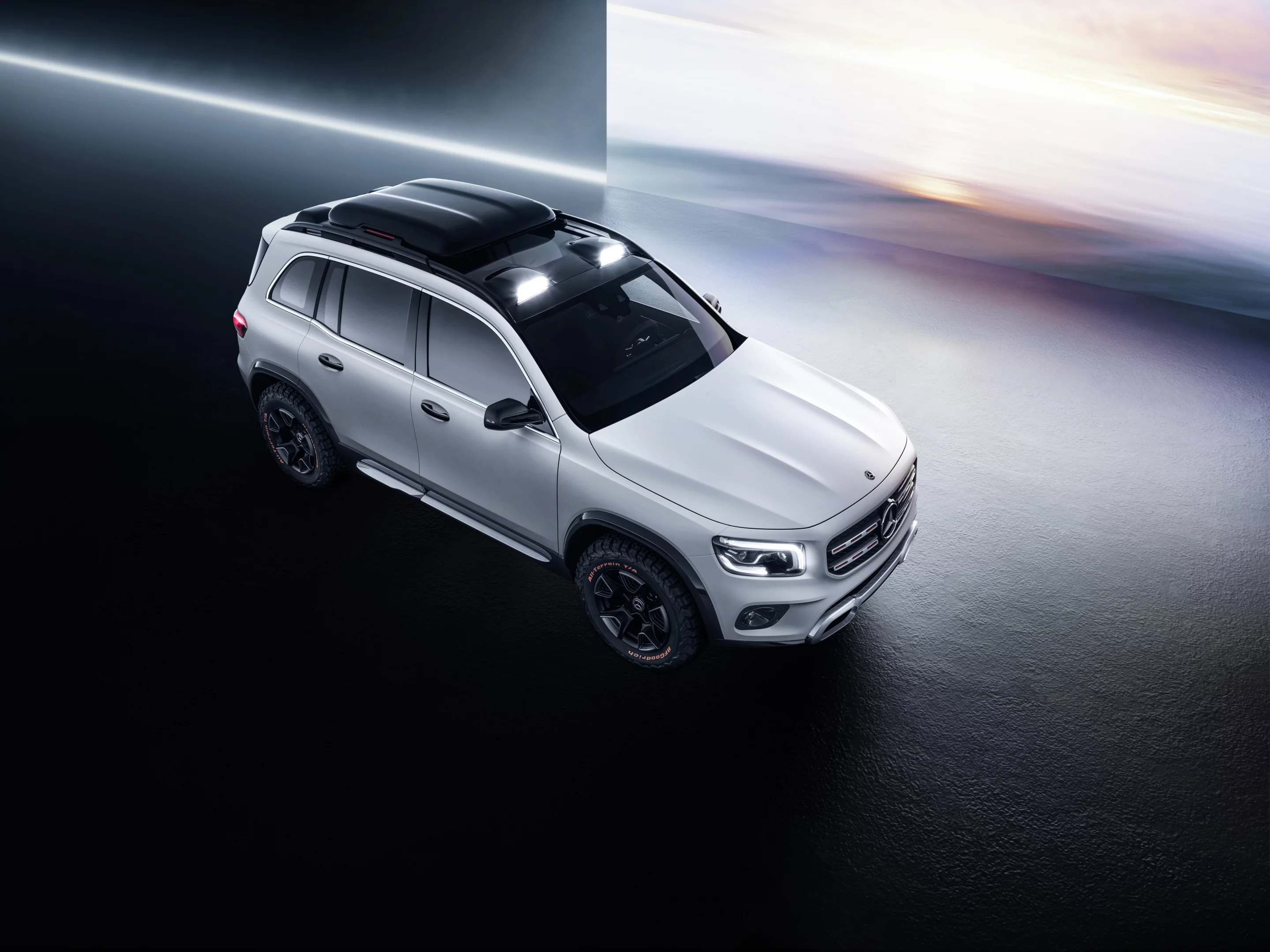 The wheelbase appears short compared to the crossover’s track width, accented by thick fender flares and squared-off elements on the fascia