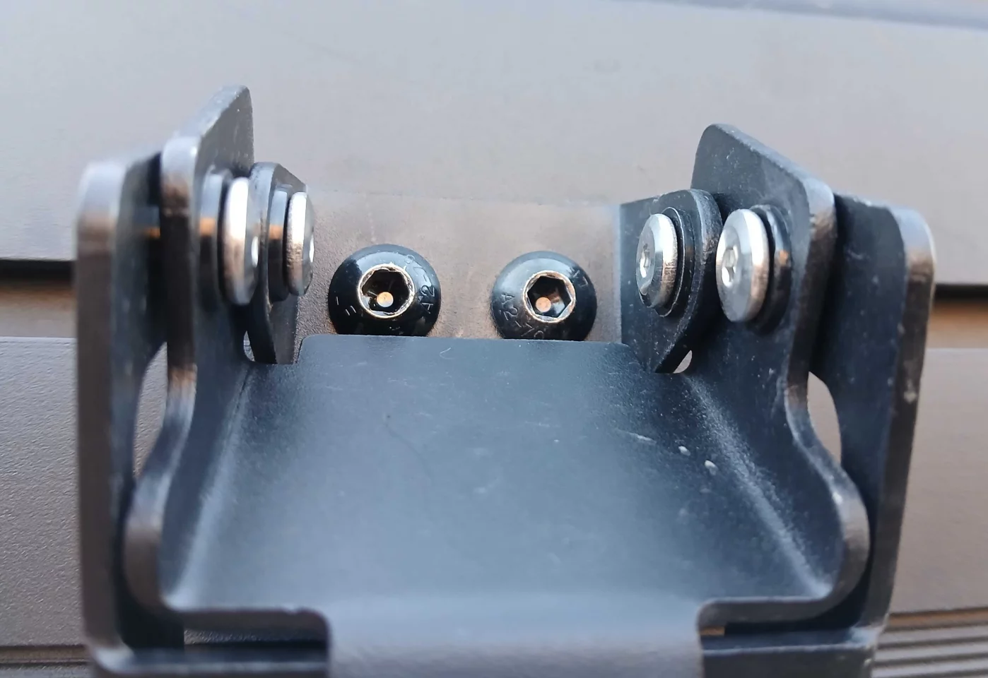 We're not sure why Topoak bolts the latches to the T-track with easily removed hex bolts, but they proved a life saver when we forgot the key to unlock the latches