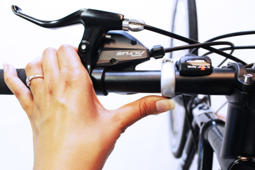 A bar-mounted thumb switch is used to select between the Caron Bicycle's different pedaling modes