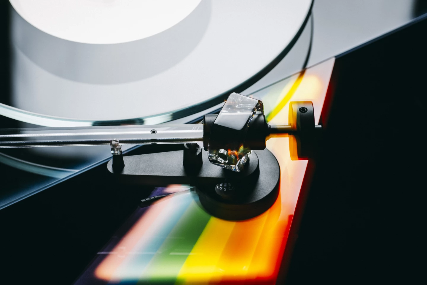 The straight acrylic tonearm is mounted atop the rainbow, and ends in a special-edition cartridge