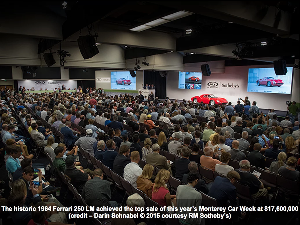 Crowds bid on a 1964 Ferarri 250 LM during the RM Sotheby's Auction