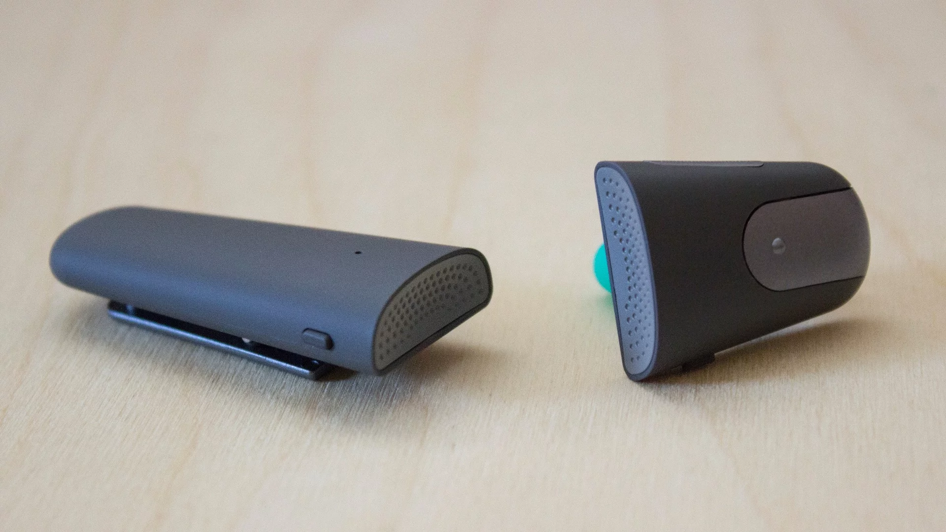 The two pieces of the Soundhawk system: the wireless mic (left) and the scoop earpiece