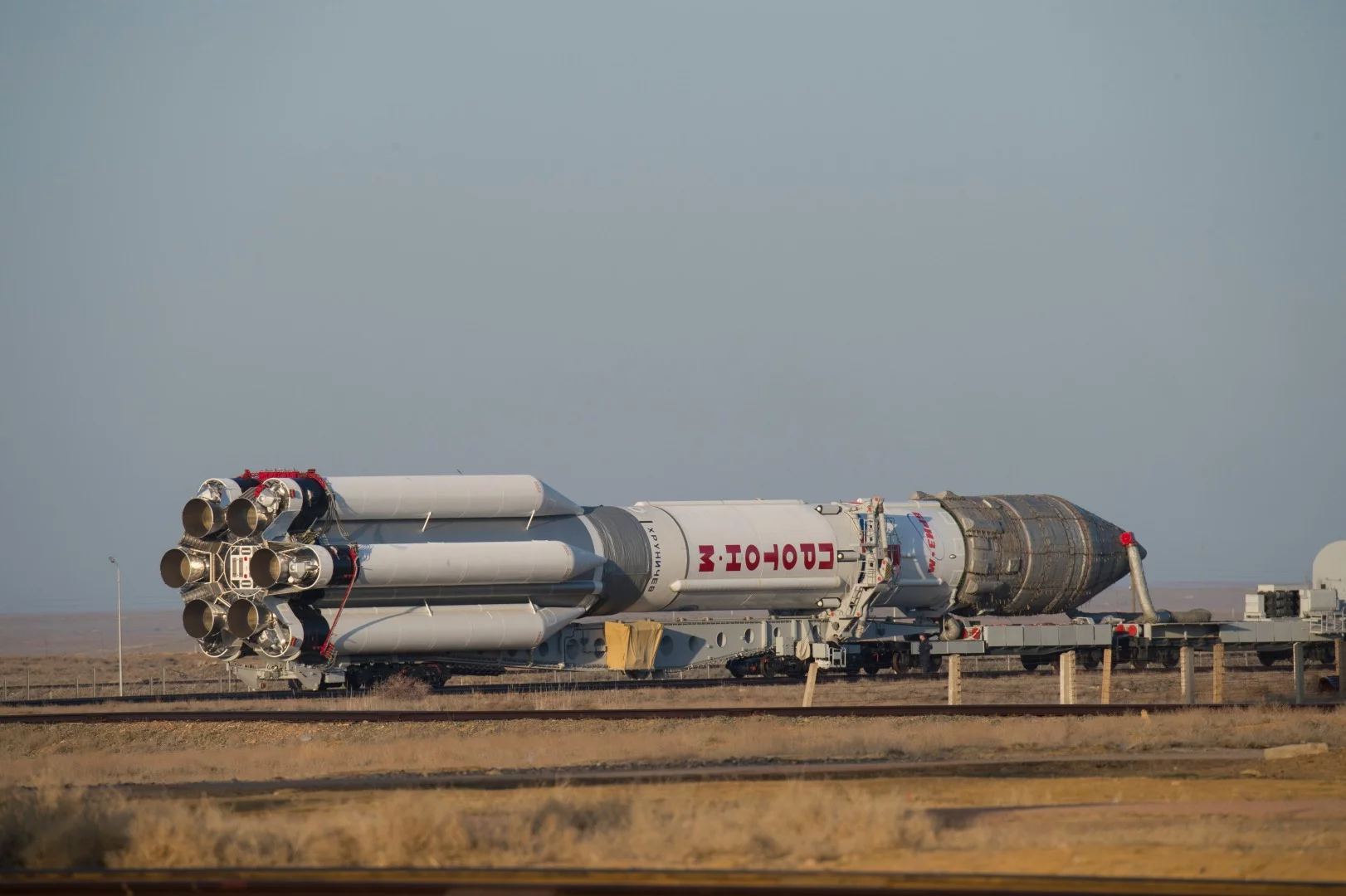 The three-stage Proton launch vehicle rolling out