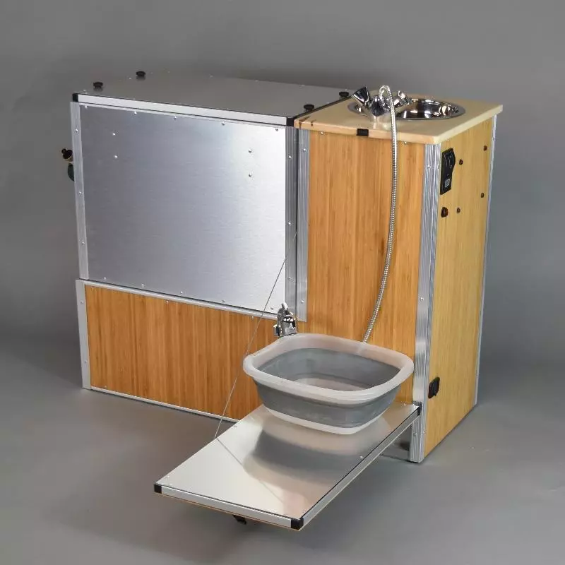 The TK Van Kitchen has a drop-down work surface for outside use