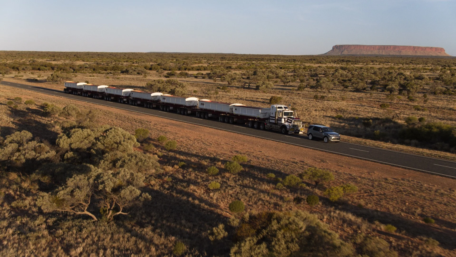The road train and Discovery in the Australian outback