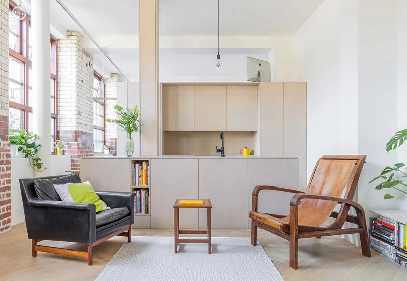 London-based architectural studio Suprblk has transformed an apartment inside an old biscuit factory by incorporating bespoke pods instead of walls