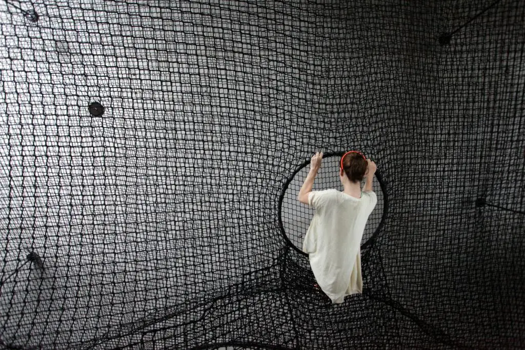 Circular openings in Net Linz provide access to the installation