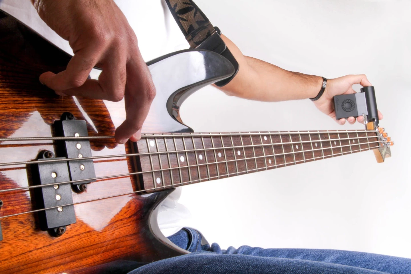 The motorized peg turner at the end of the Roadie Bass automatically brings a plucked string to pitch