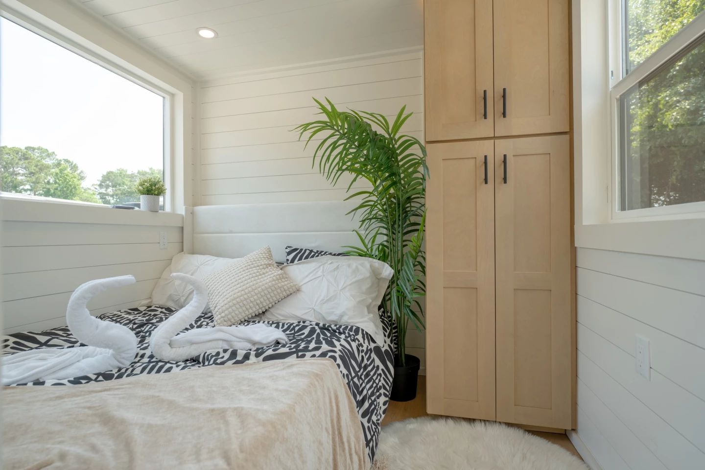 The Avalon V2's downstairs bedroom has ample headroom to stand upright and includes a double bed with integrated storage space and a wardrobe