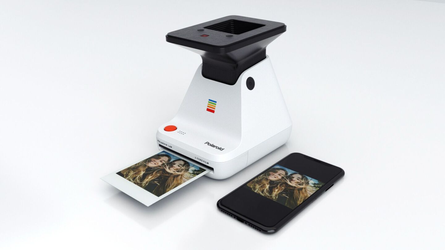 Placing a smartphone on top of the cradle and pushing the red button results in an instant photo being printed