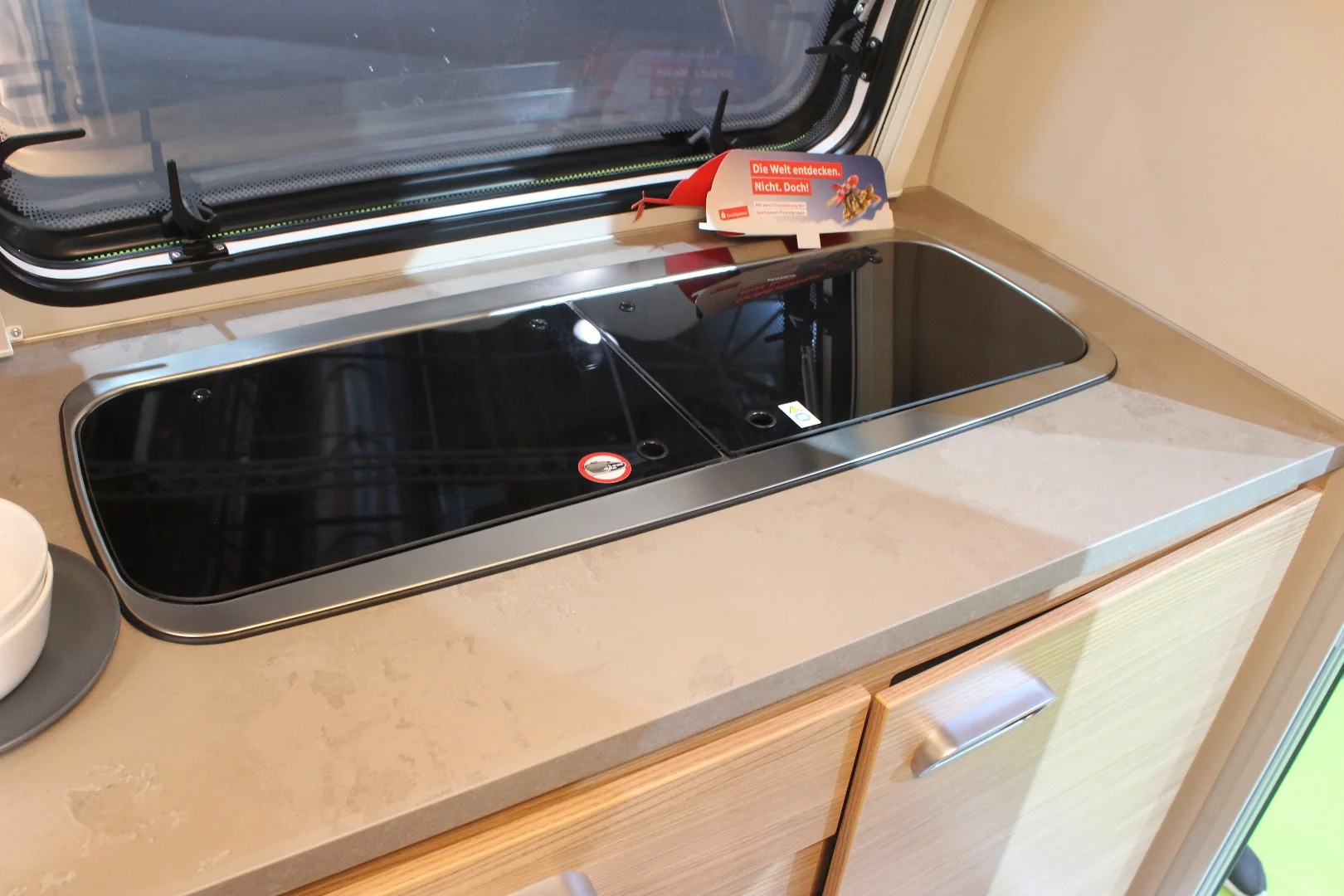 Larger than other teardrops, the T@b Offroad includes a dinette and indoor kitchen area