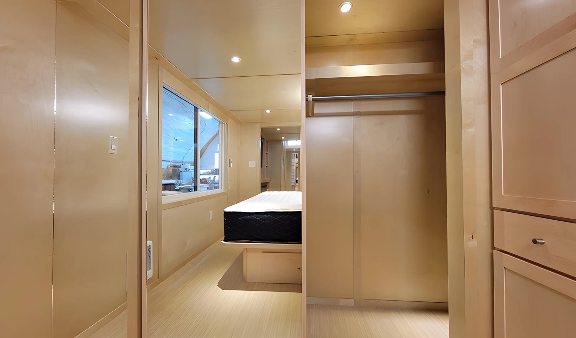 The Ultimate tiny house's master bedroom has a large closet that can instead become an optional en-suite bathroom