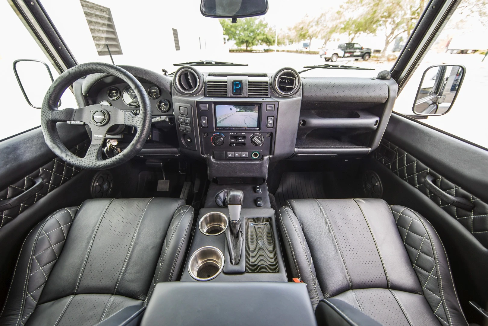East Coast Defender has thoroughly upgraded the interior, adding leather, a full infotainment system, upgraded gauges and more