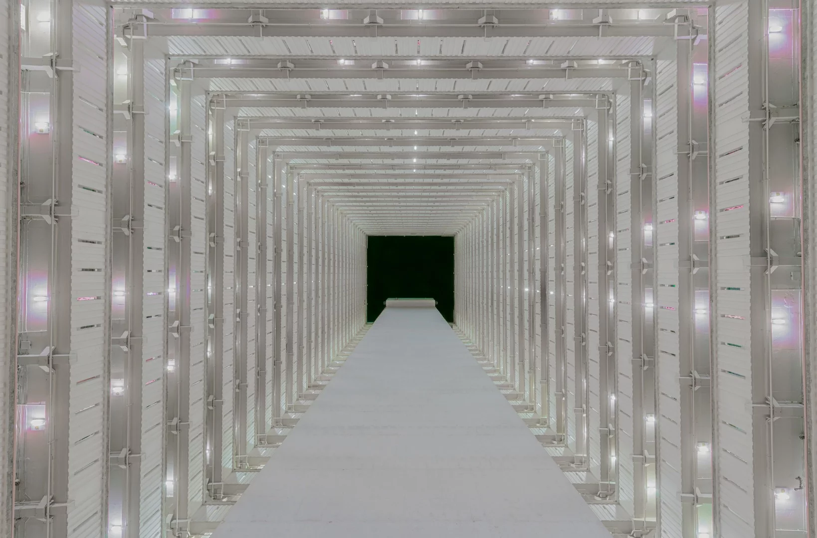 A block at night with the dark sky in the distance