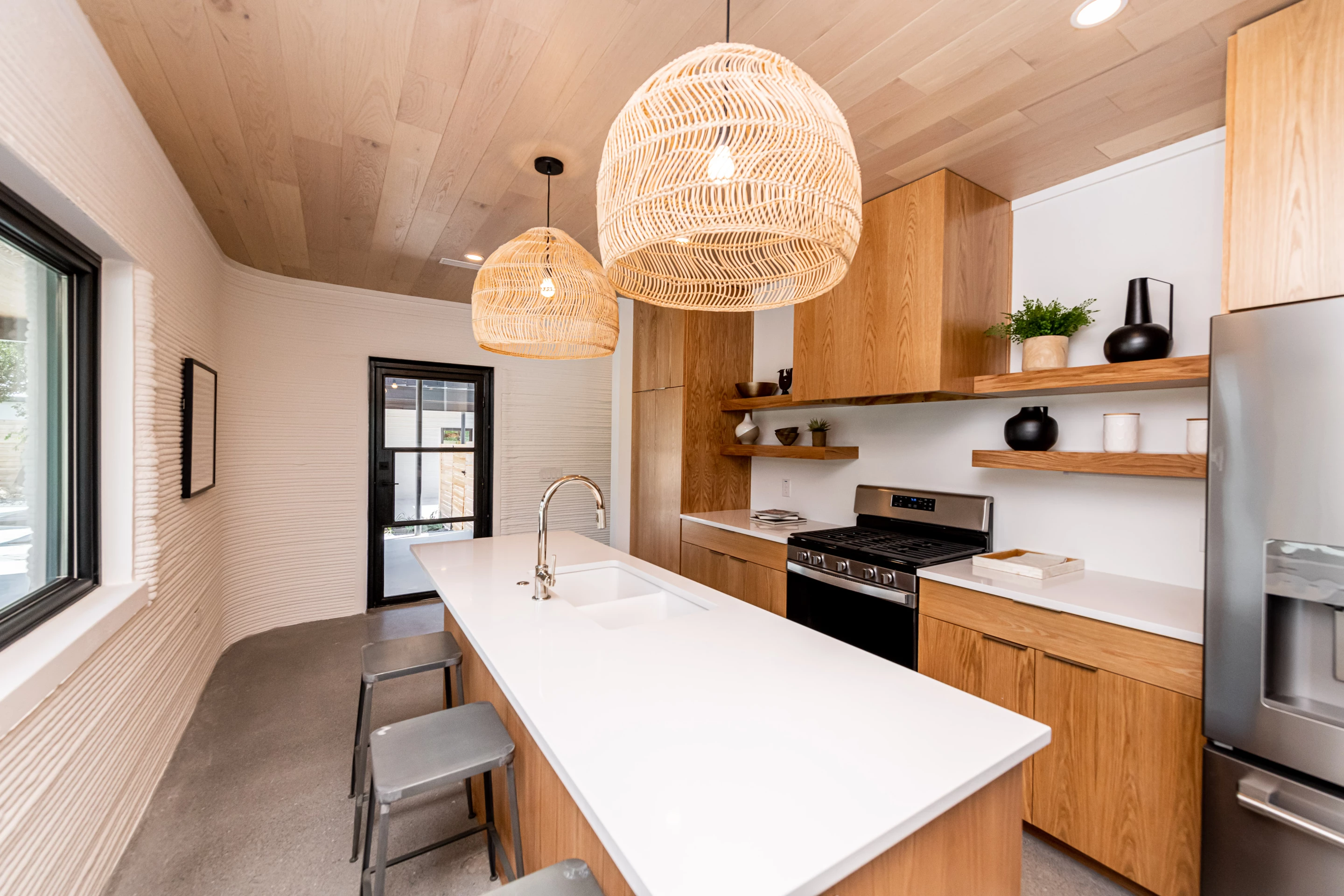 Austin-based designer Claire Zinnecker handled interior design duties and focused on natural wood and stainless steel kitchen appliances