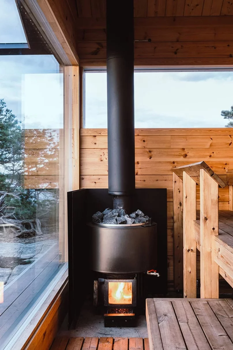 Hot running water is produced by the sauna's stove, which also provides heating to the floors throughout the two cabins
